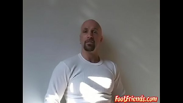 Muscular bald stud Anthony teasing and playing with his feet